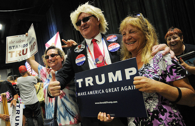Dan Conneally poses with supporters during a Trump rally at the Tampa Convention Center on June 11, 2016 in Tampa, Florida (Photo by Gerardo Mora/Getty Images)